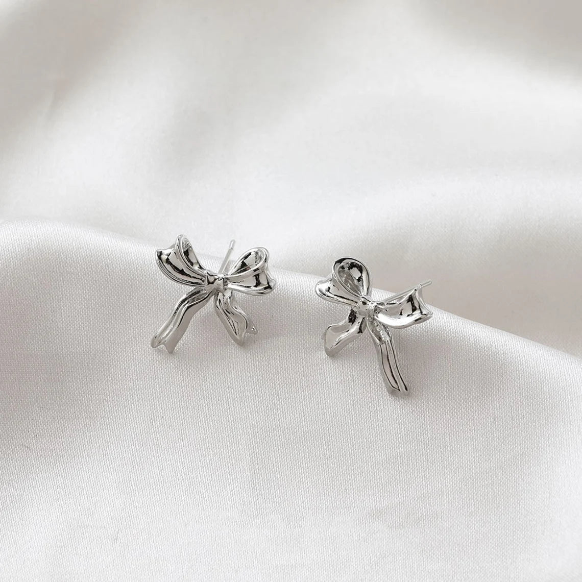 White Gold Stud Earrings with Bow Motif