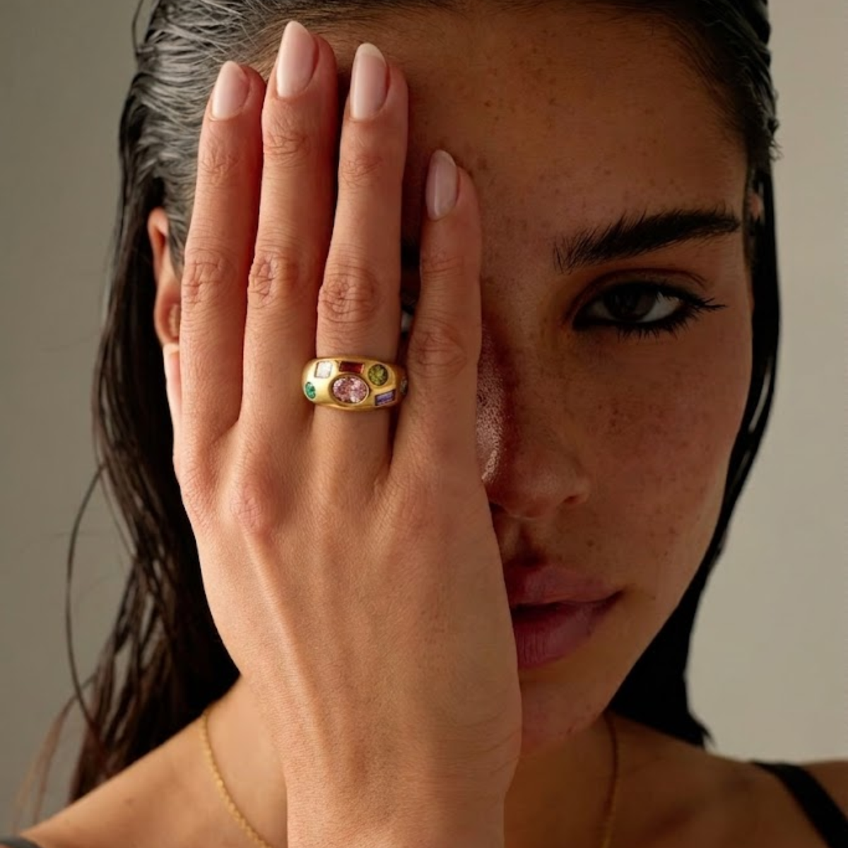 Women’s Ring with Oval Center Stone and Multiple Geometric Stone Accents