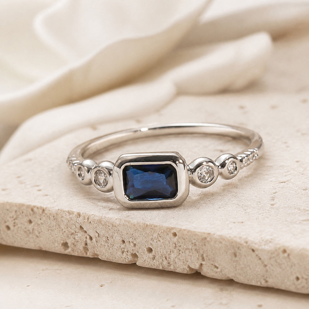 Women’s Ring with Oval Center Stone and Clear Prong Setting