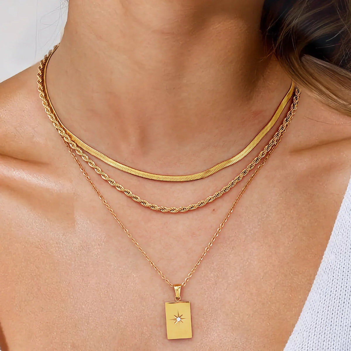 Women's Multilayered Necklace with Three Fine Chains and Stone Accents
