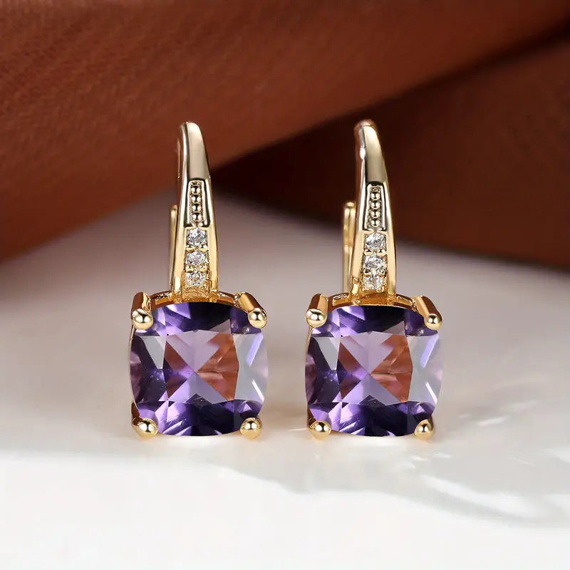 Claudine – Golden Hoop Earrings with Mystical Sapphire