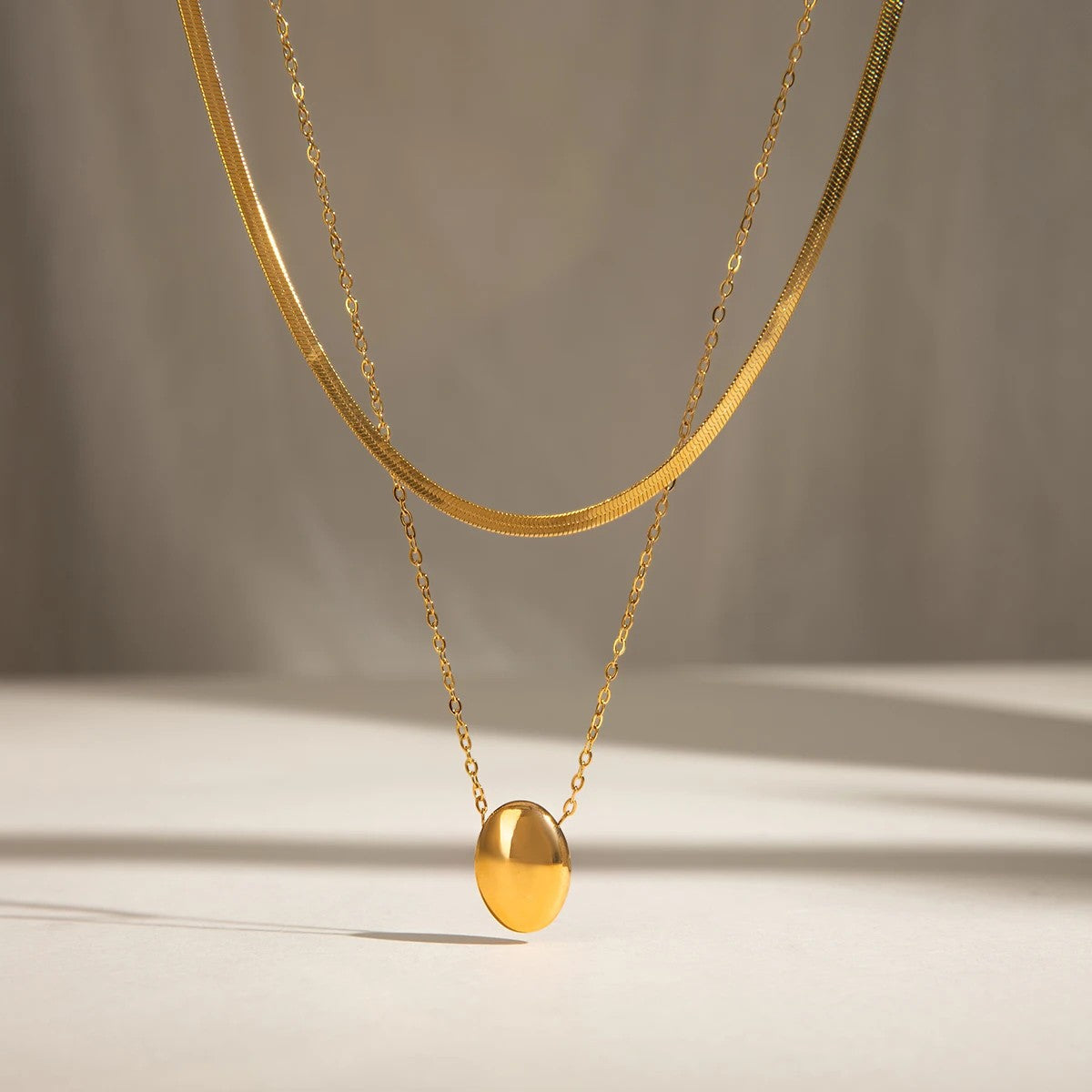 Women’s Layered Necklace with Oval Pendant and Two Different Chains