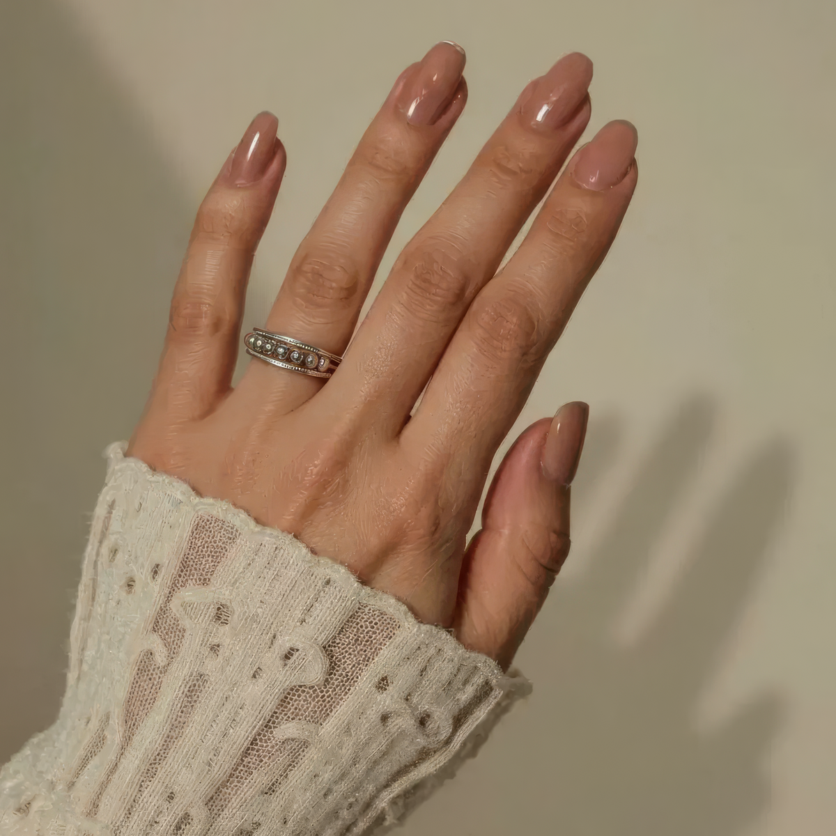 Women's Ring with Moving Round Elements and Stone-Set Edges