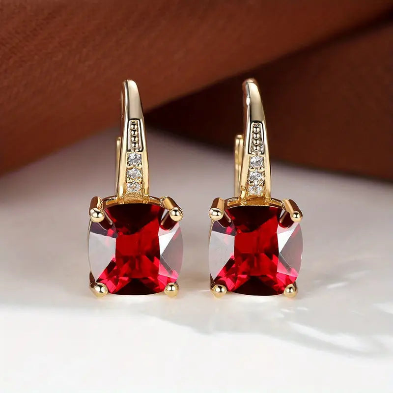 Claudine – Golden Hoop Earrings with Mystical Sapphire
