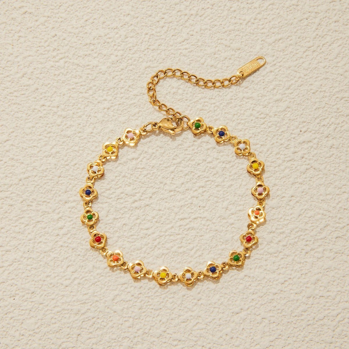 Women’s Charm Bracelet with Multiple Round Motifs and Distributed Stone Accents