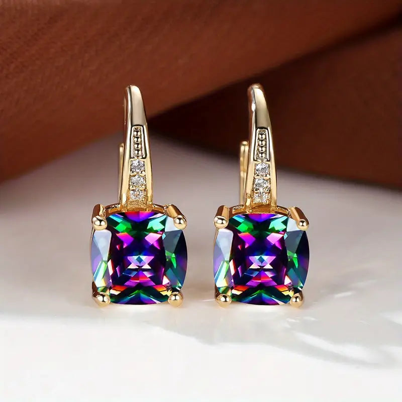 Claudine – Golden Hoop Earrings with Mystical Sapphire