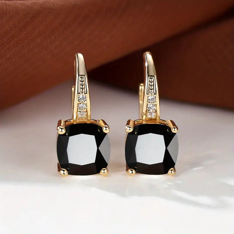 Claudine – Golden Hoop Earrings with Mystical Sapphire
