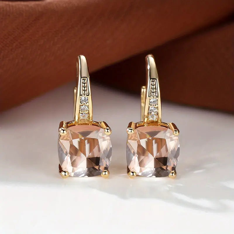 Claudine – Golden Hoop Earrings with Mystical Sapphire