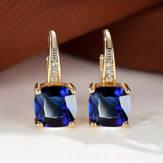 Claudine – Golden Hoop Earrings with Mystical Sapphire