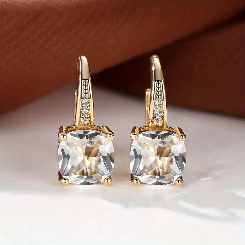 Claudine – Golden Hoop Earrings with Mystical Sapphire