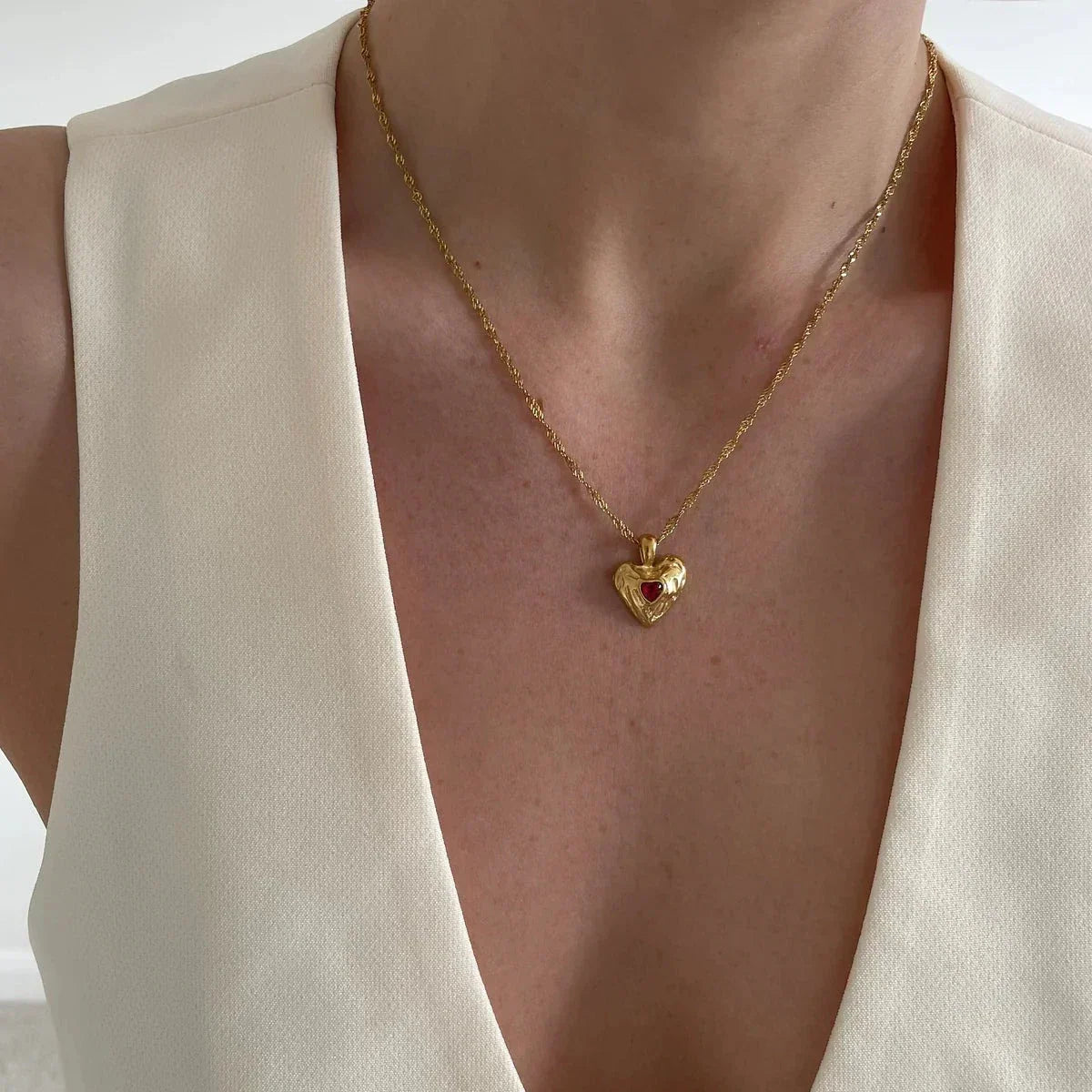 Women's Heart Pendant Necklace with Wavy Surface and Twisted Chain