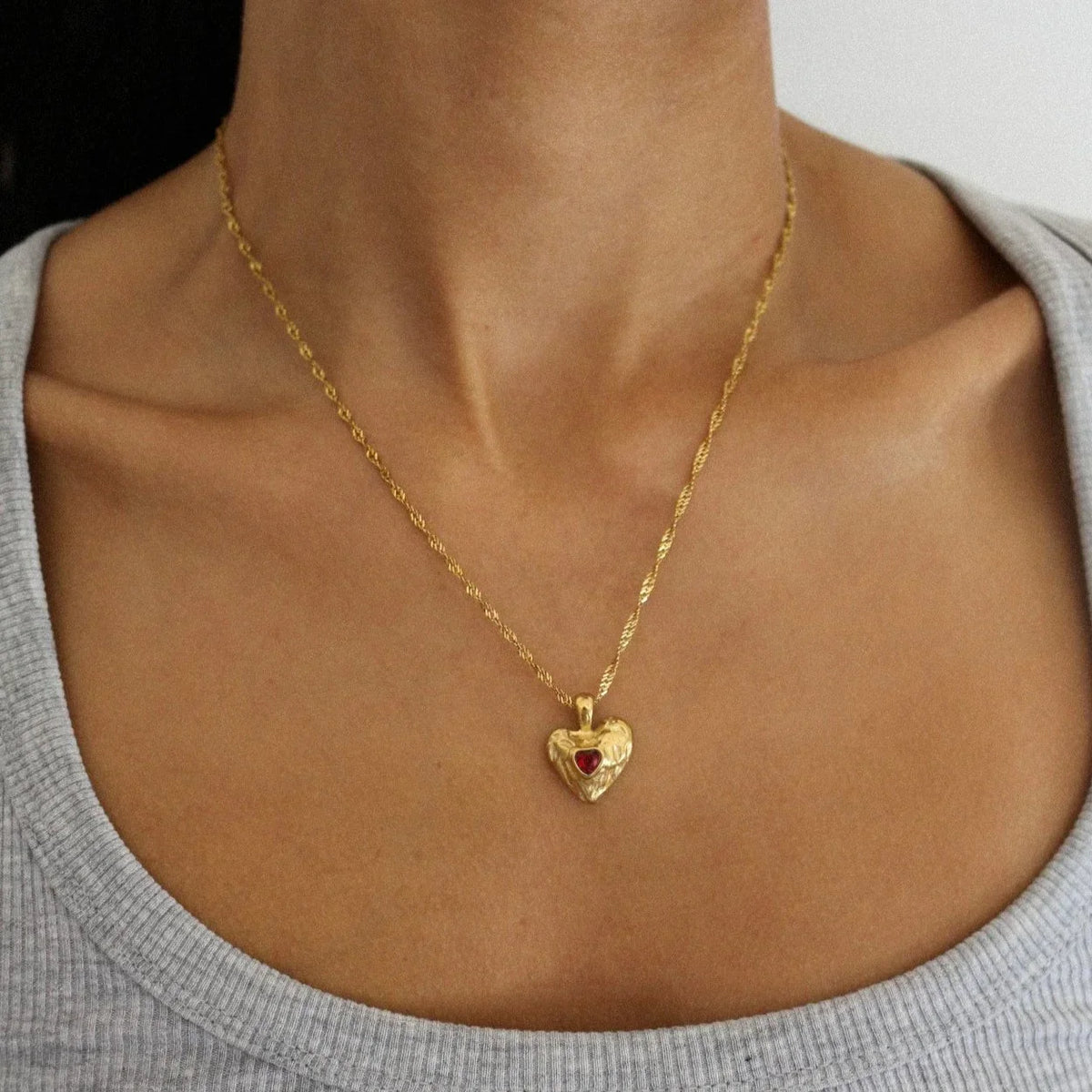 Women's Heart Pendant Necklace with Wavy Surface and Twisted Chain
