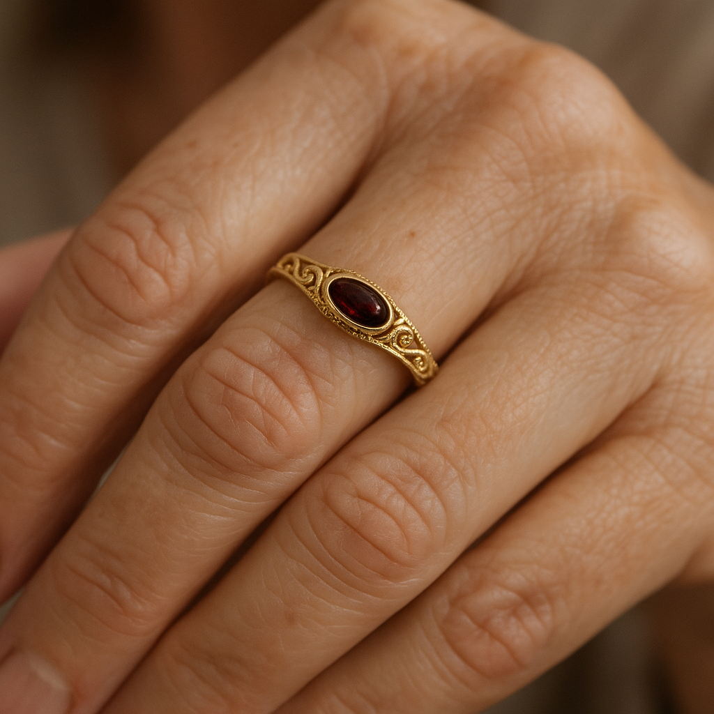 Women’s Statement Ring with Deep Red Center Stone and Ornamental Setting