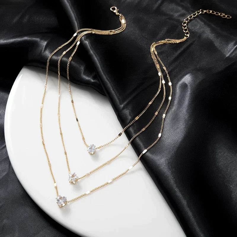Sally – Gold chain with three zirconia pendants
