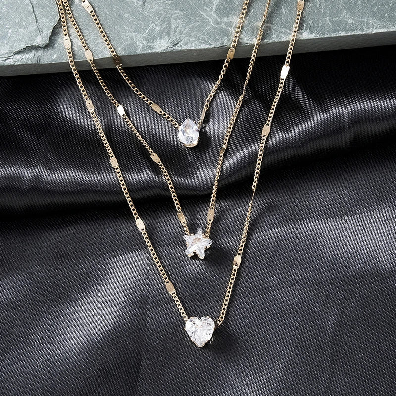 Sally – Gold chain with three zirconia pendants