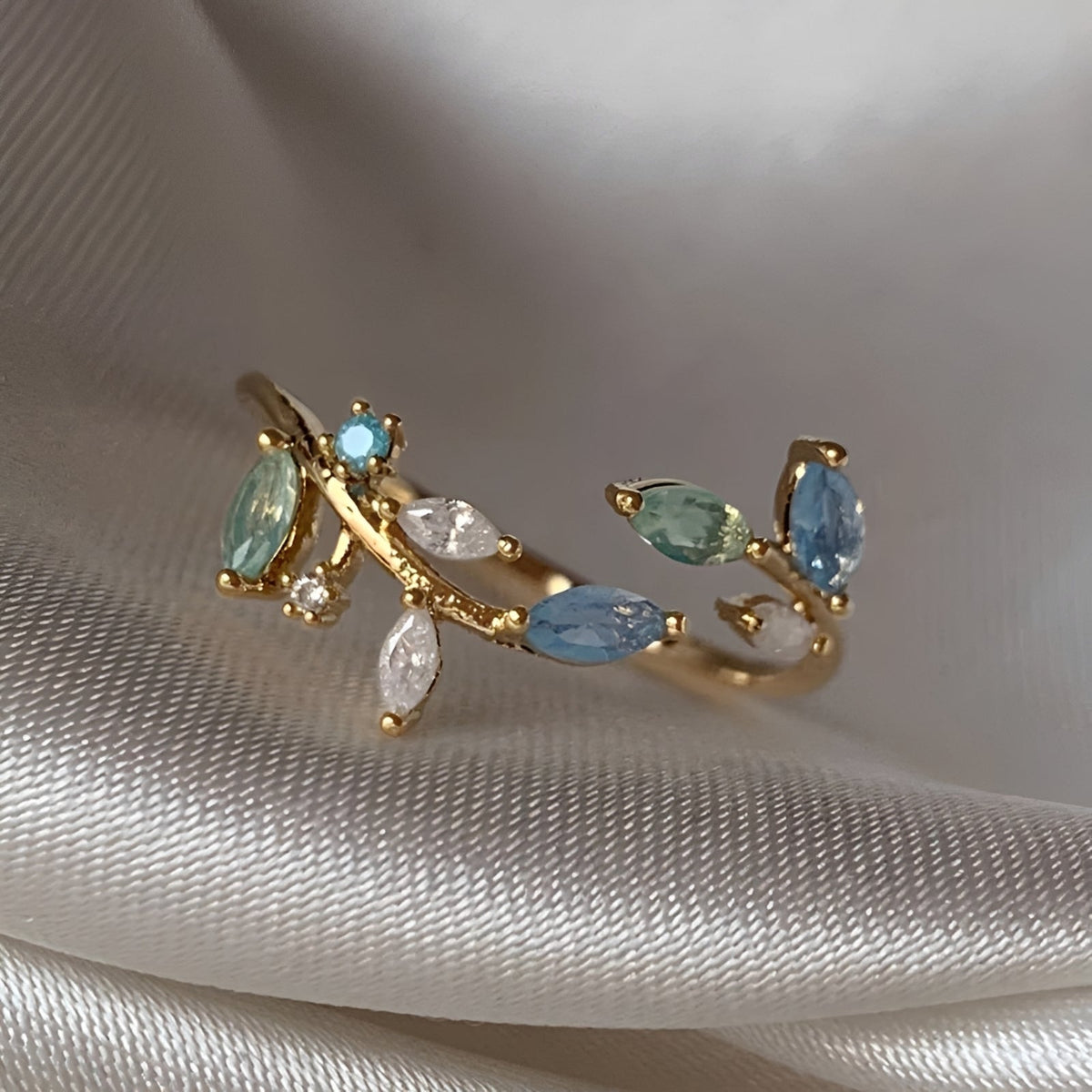 Women’s Open Ring with Leaf Motifs and Multiple Marquise Stones