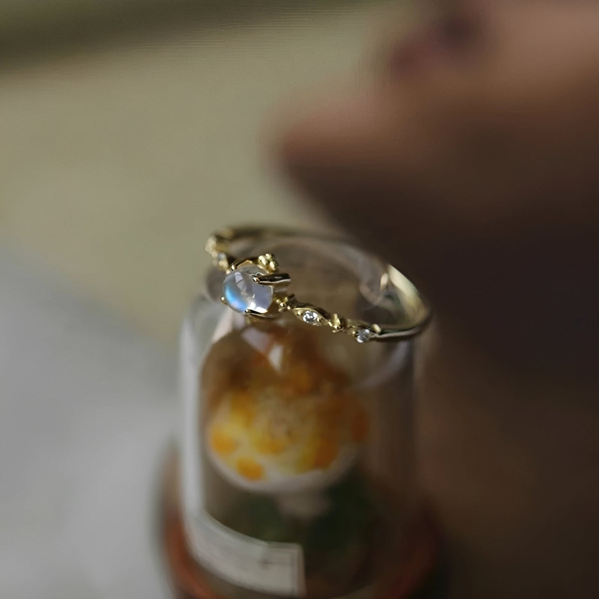 Women’s Ring with Round Moonstone Center Stone and Side Stone Accents