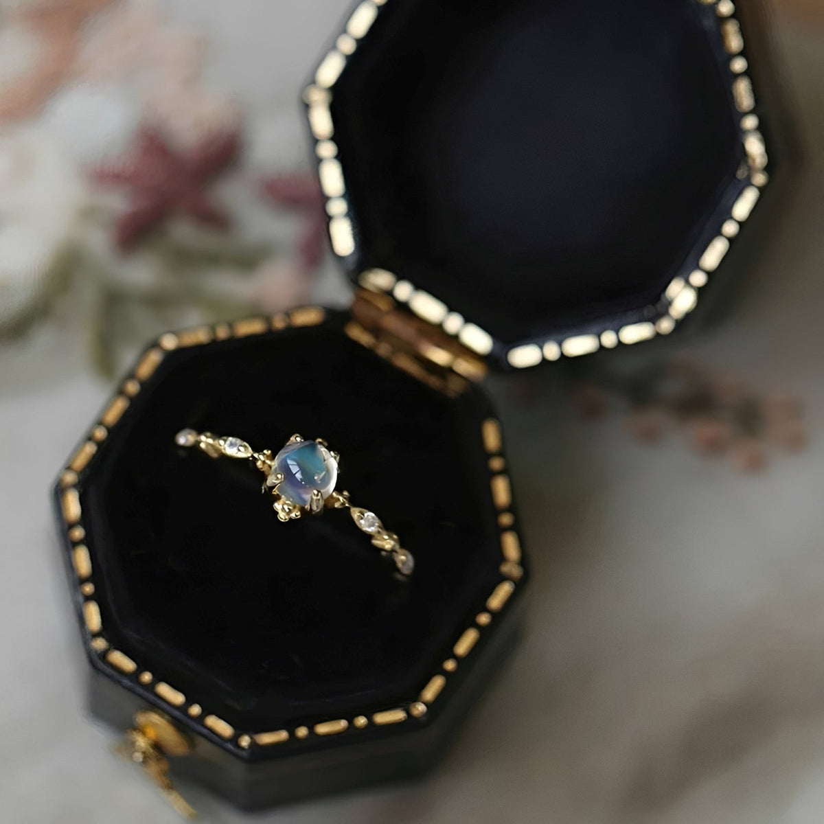 Women’s Ring with Round Moonstone Center Stone and Side Stone Accents