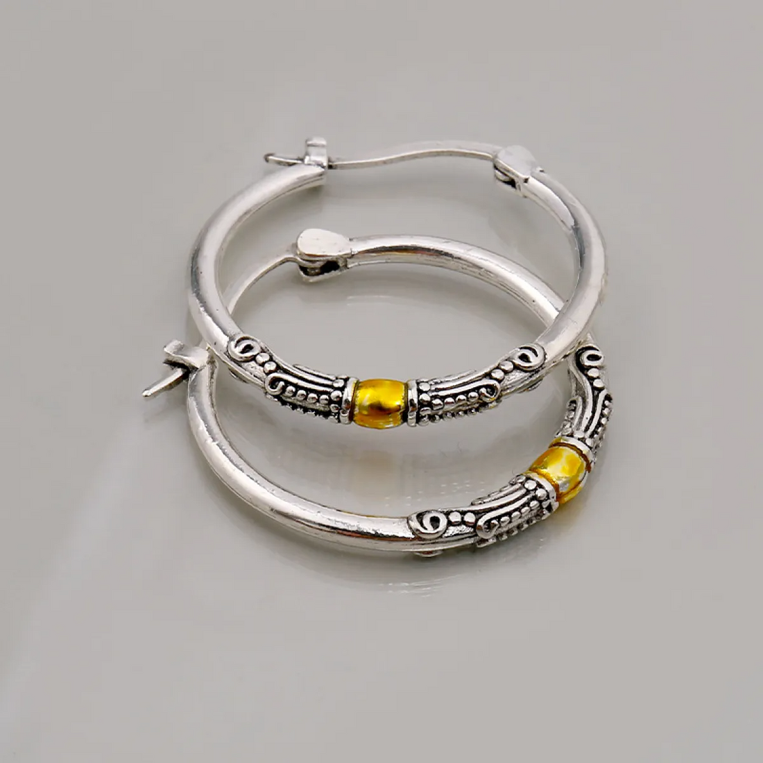 Women’s Hoops with Engraved Ornament Details and Central Accent Element