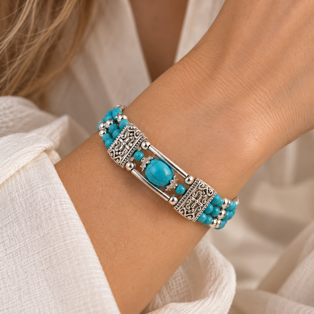 Women’s Multi-Strand Pearl Bracelet with Round Center Piece and Ornamental Details