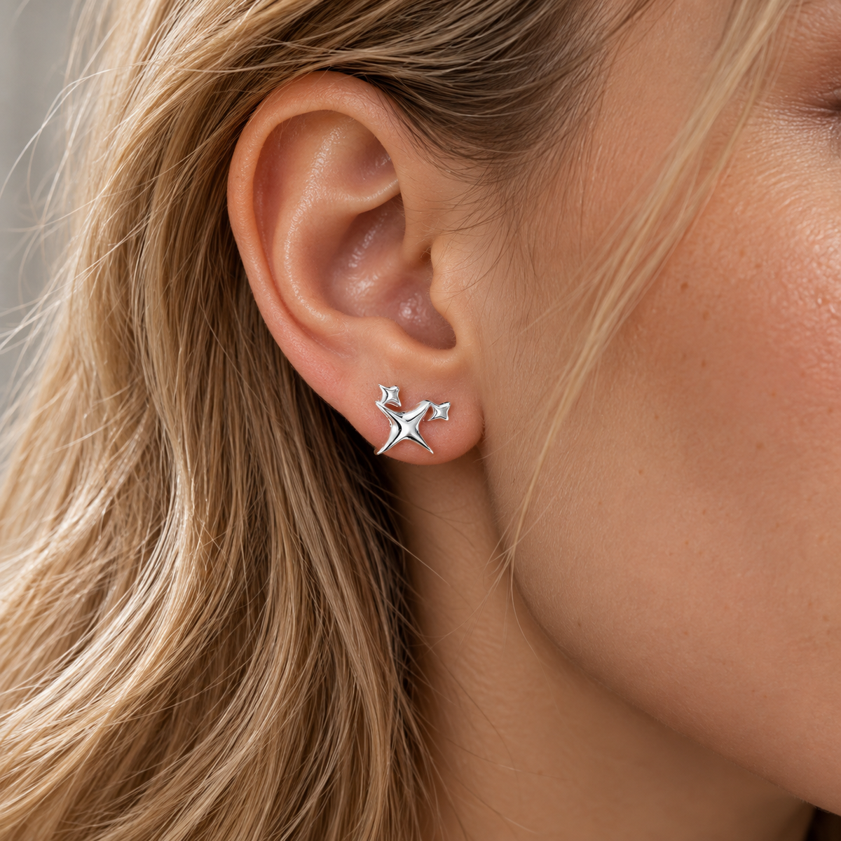 Women’s Ear Studs with Triple Star Motif and Polished Surface