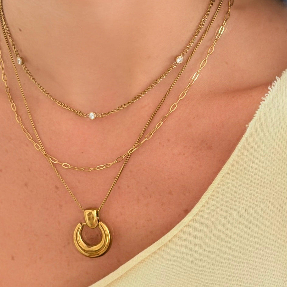 Women's Pendant Necklace with Round Open Pendant and Sculptural Form