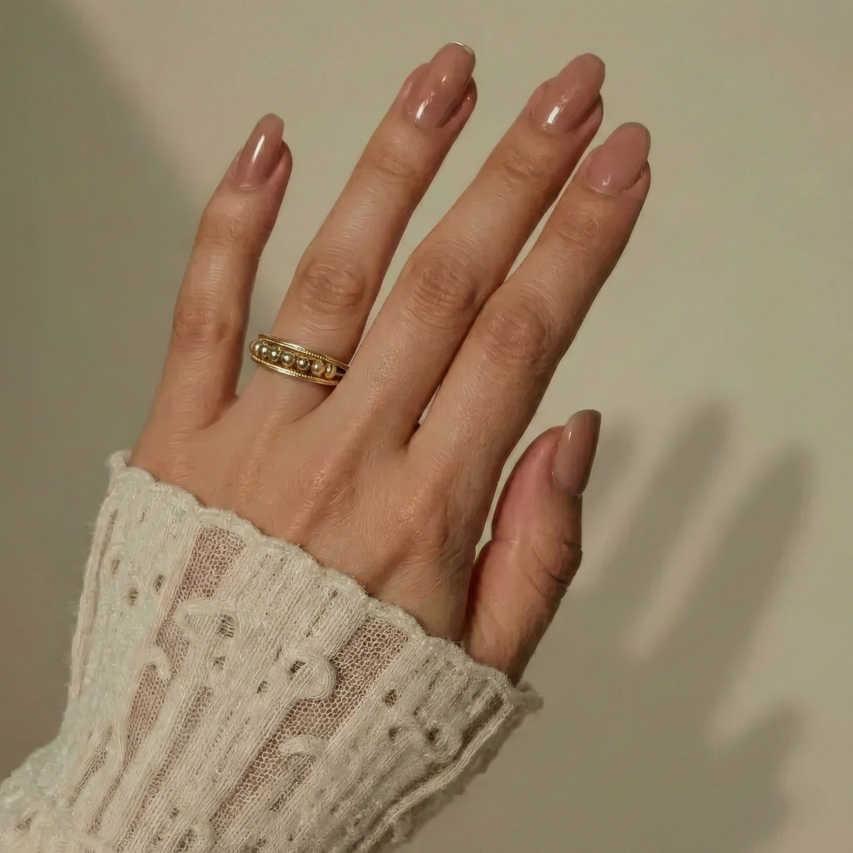 Women's Ring with Moving Round Elements and Stone-Set Edges