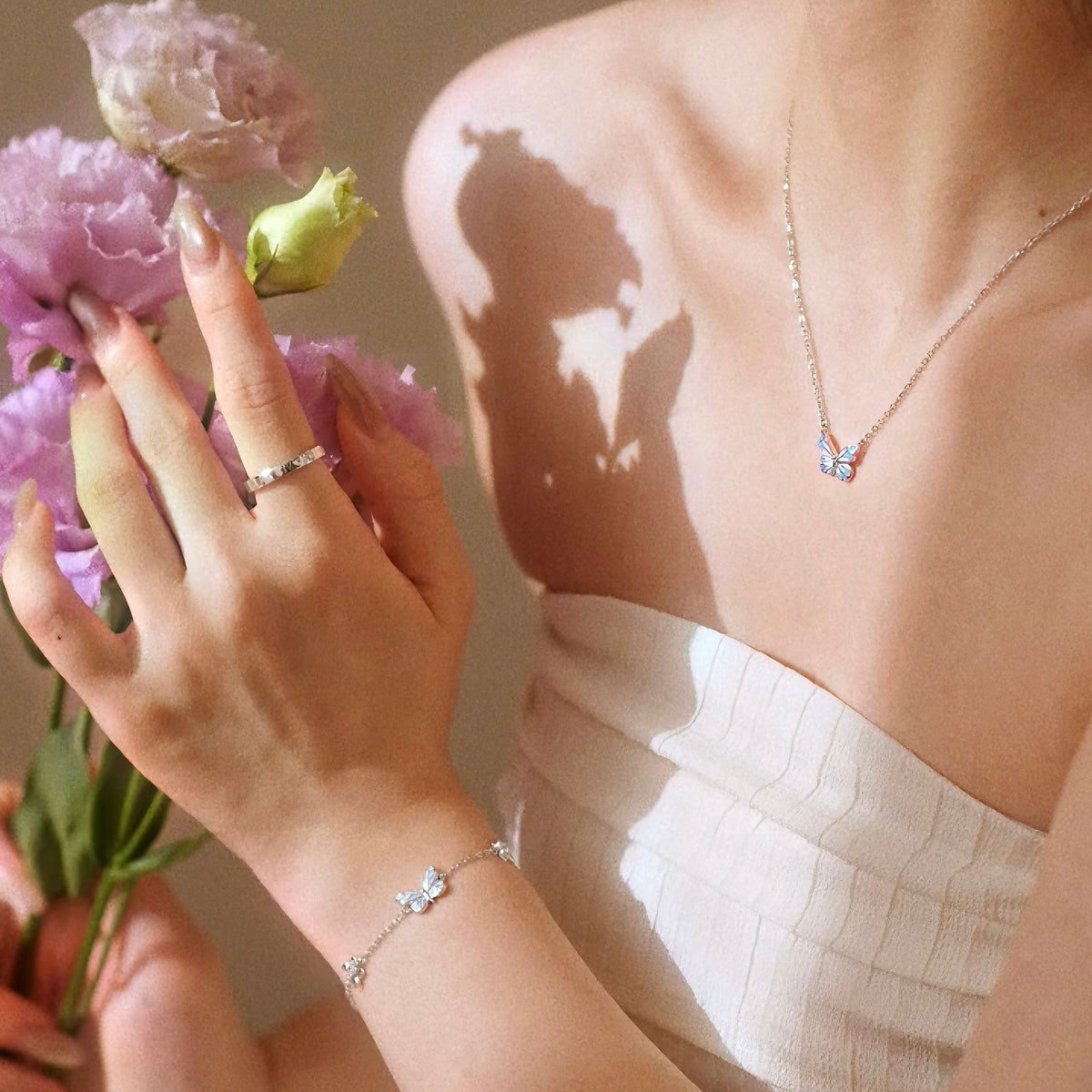 Women's Butterfly Bracelet with Glowing Pendant and Floral Details