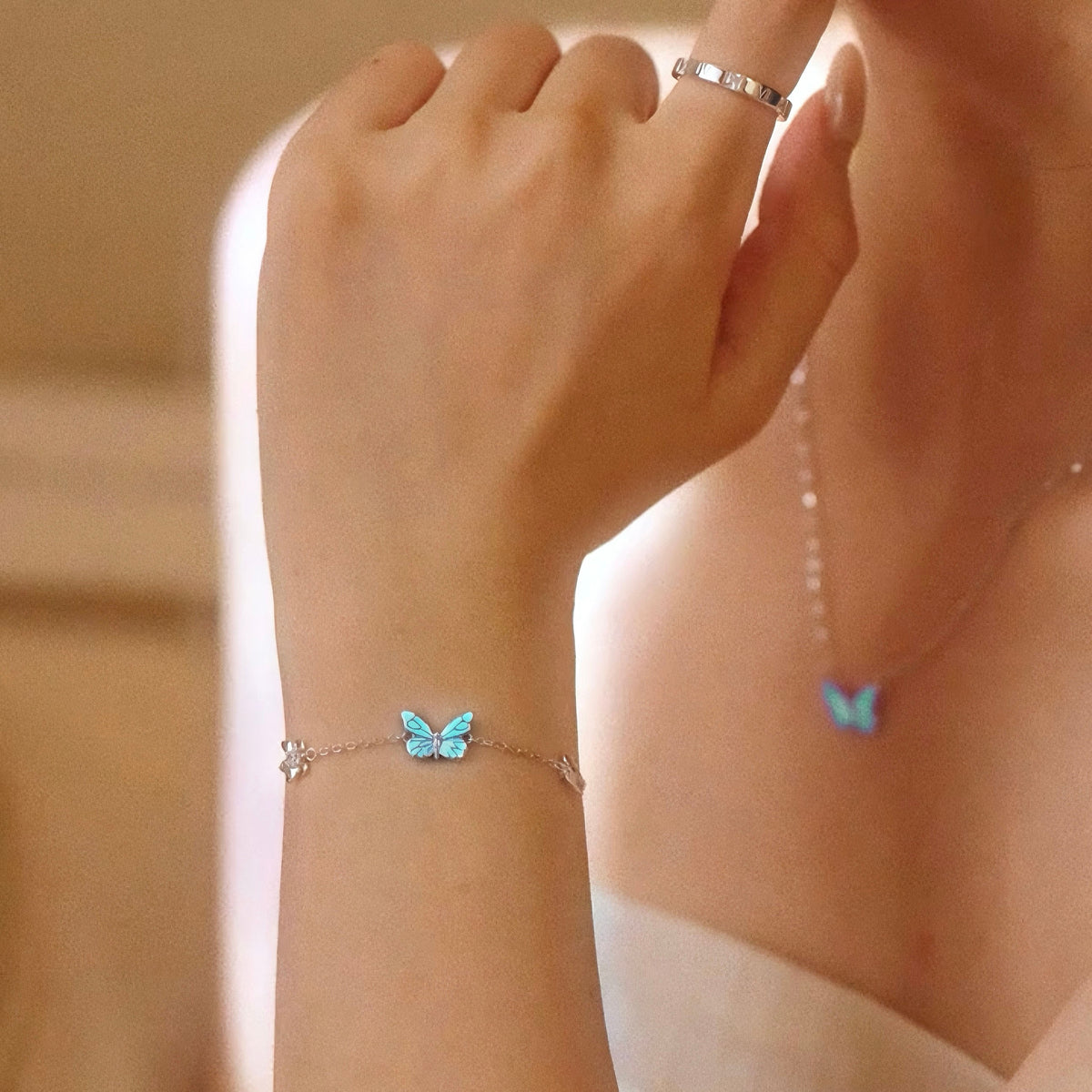 Women's Butterfly Bracelet with Glowing Pendant and Floral Details