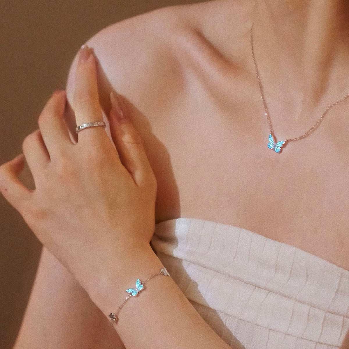 Women's Butterfly Bracelet with Glowing Pendant and Floral Details