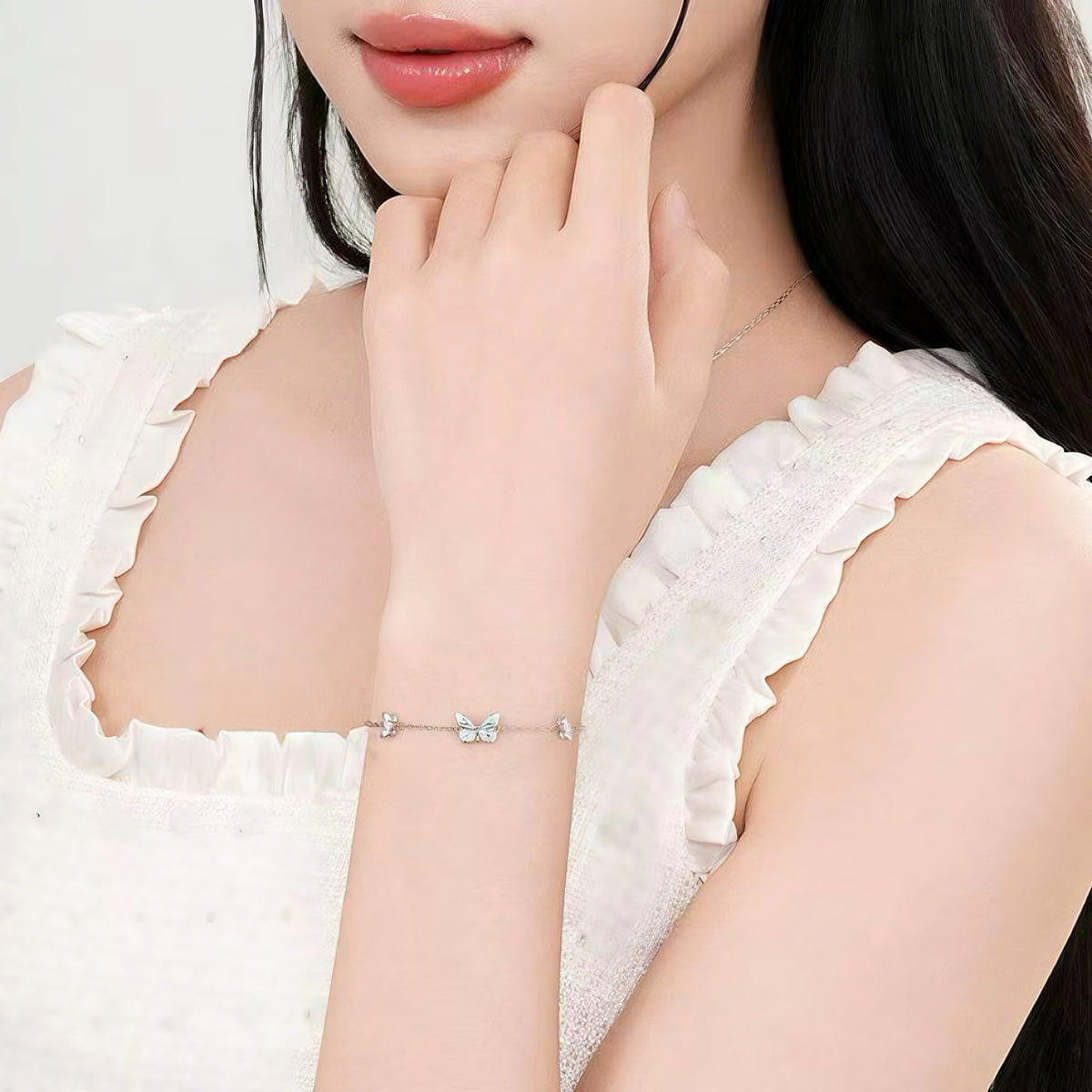Women's Butterfly Bracelet with Glowing Pendant and Floral Details