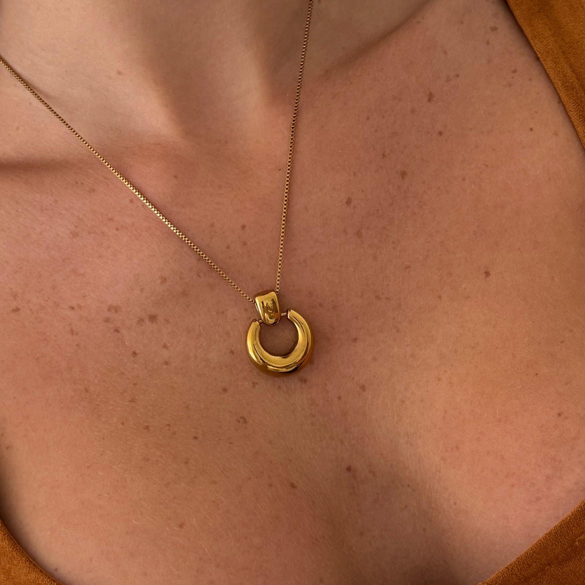 Women's Pendant Necklace with Round Open Pendant and Sculptural Form