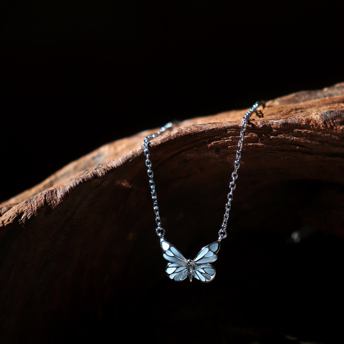 Women's Butterfly Bracelet with Glowing Pendant and Floral Details
