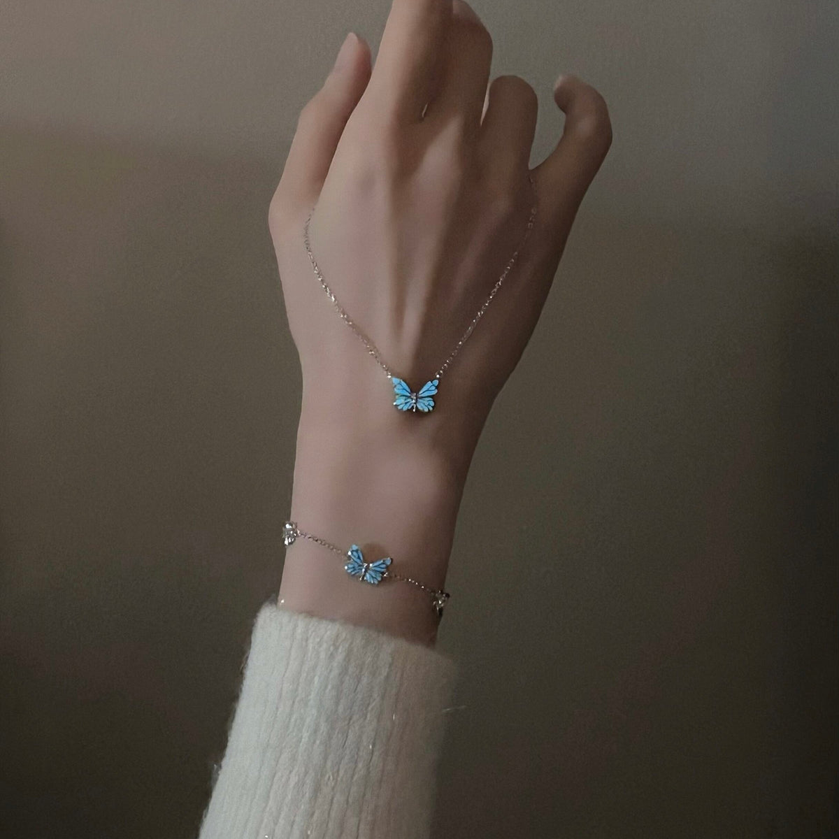 Women's Butterfly Bracelet with Glowing Pendant and Floral Details