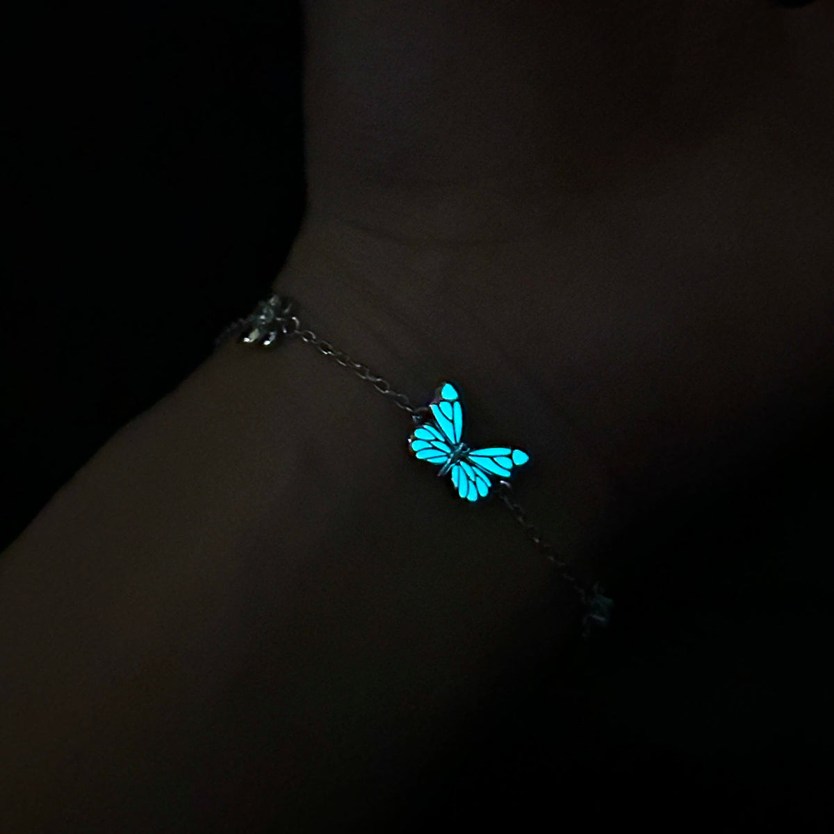 Women's Butterfly Bracelet with Glowing Pendant and Floral Details