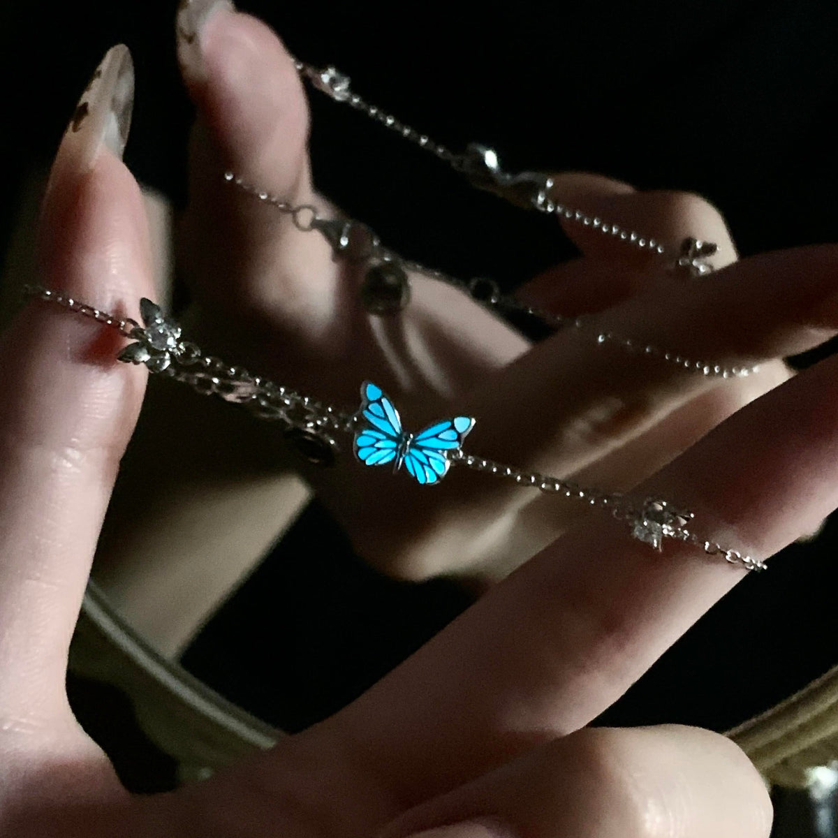 Women's Butterfly Bracelet with Glowing Pendant and Floral Details