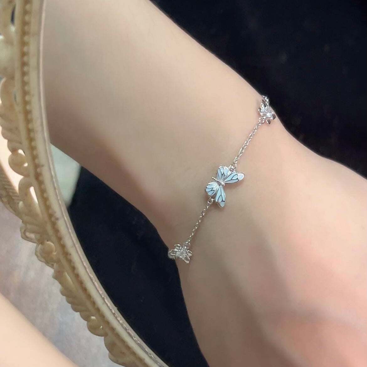 Women's Butterfly Bracelet with Glowing Pendant and Floral Details