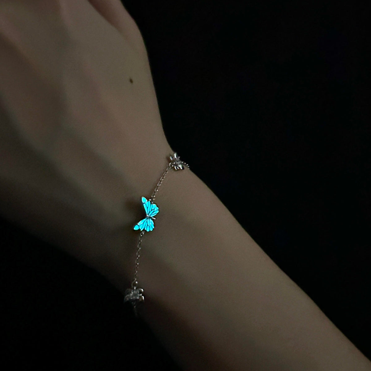 Women's Butterfly Bracelet with Glowing Pendant and Floral Details