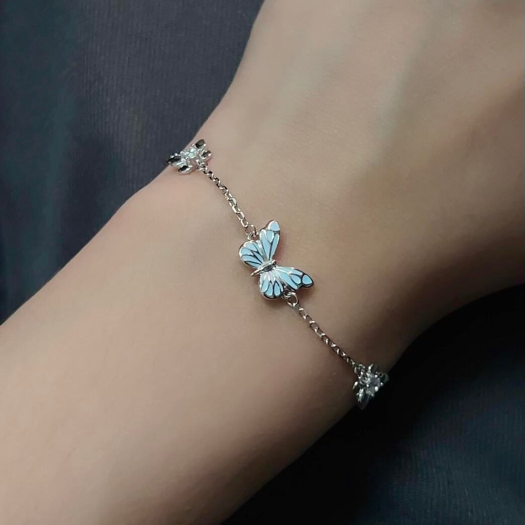 Women's Butterfly Bracelet with Glowing Pendant and Floral Details