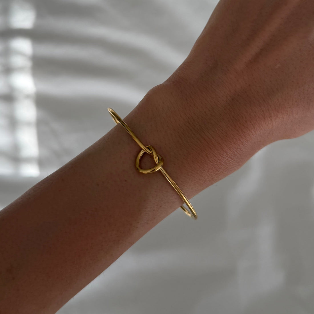 Women’s Open Bracelet with Knot Design and Ball Ends