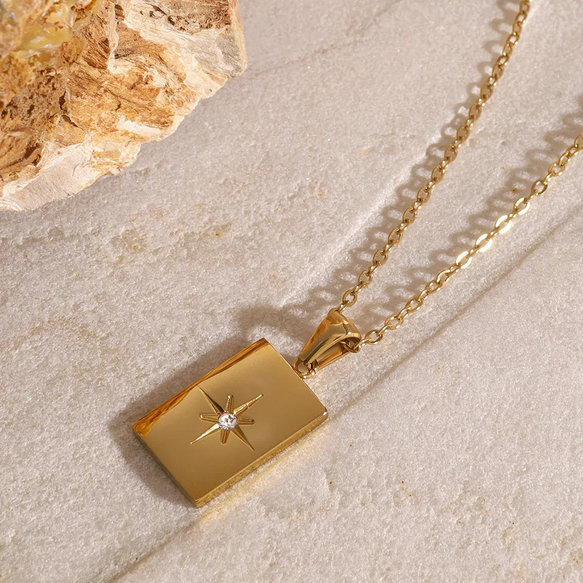 Women's Multilayered Necklace with Three Fine Chains and Stone Accents