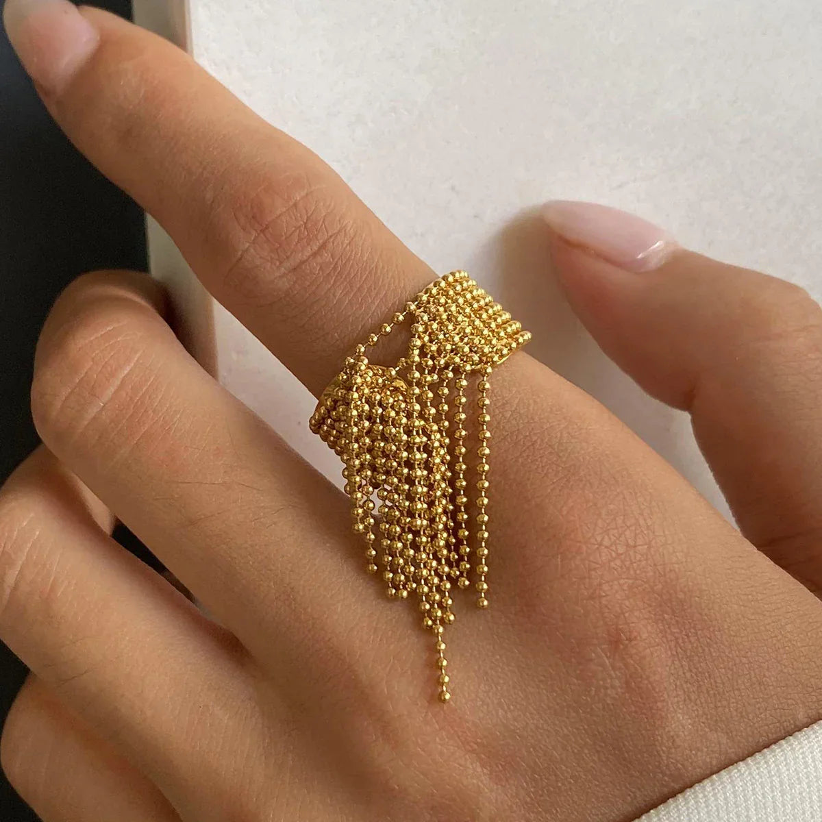 Women's Adjustable Statement Ring with Tassel Design and Multi-Row Chain Details