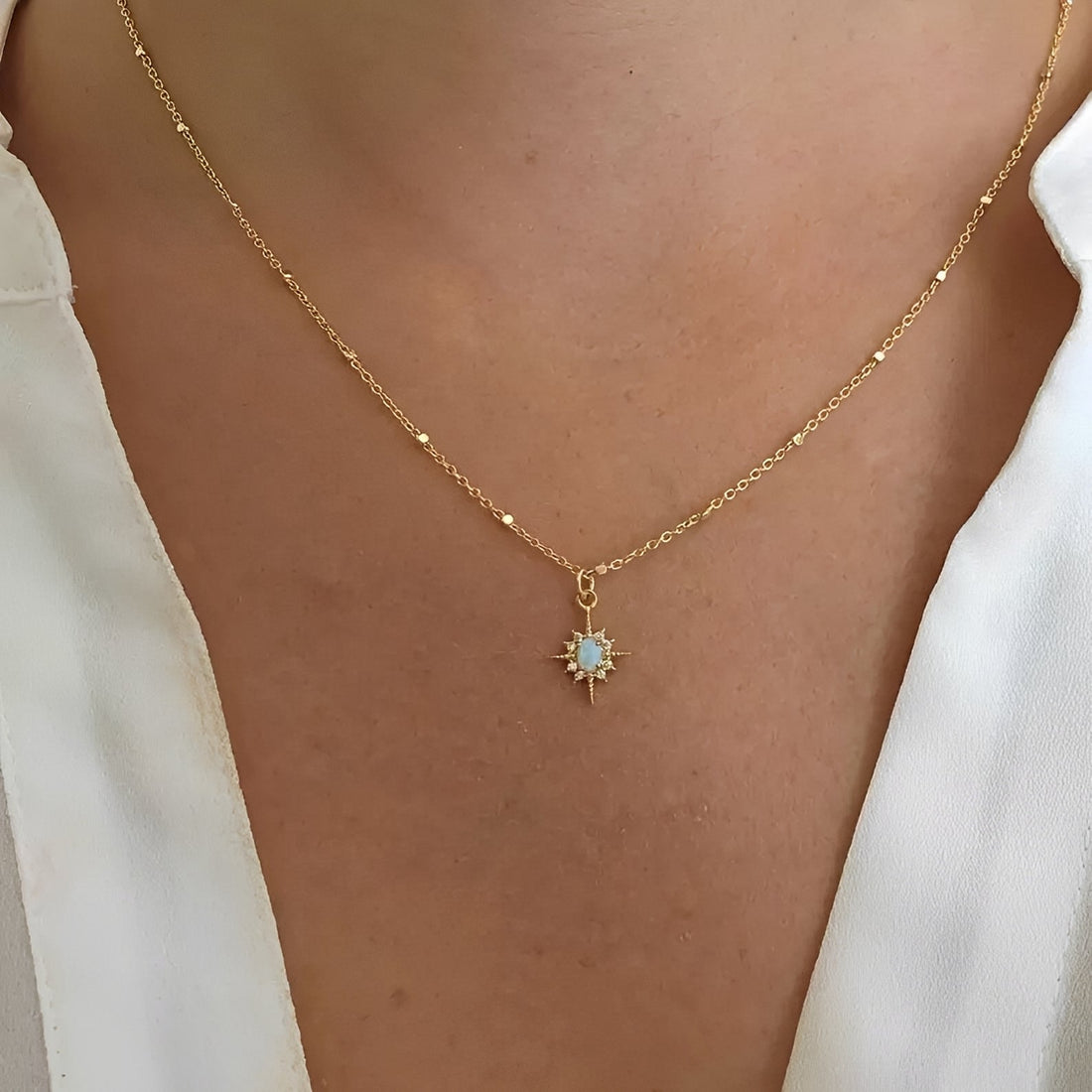 Women's Pendant Necklace with Oval Center Stone and Star Ray Design