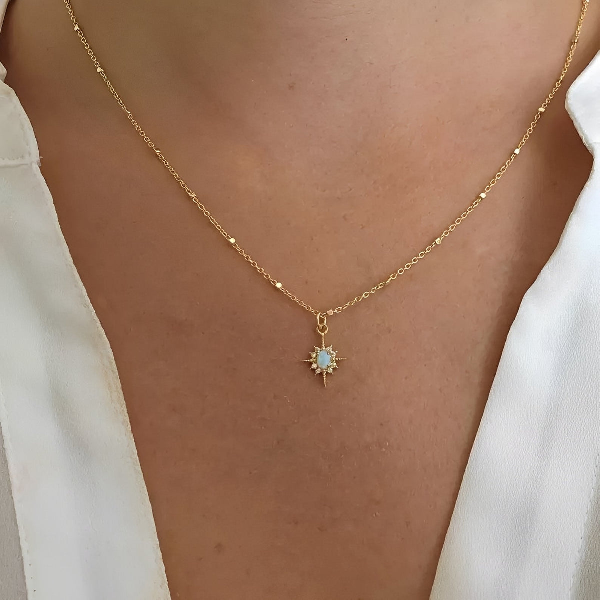 Women's Pendant Necklace with Oval Center Stone and Star Ray Design