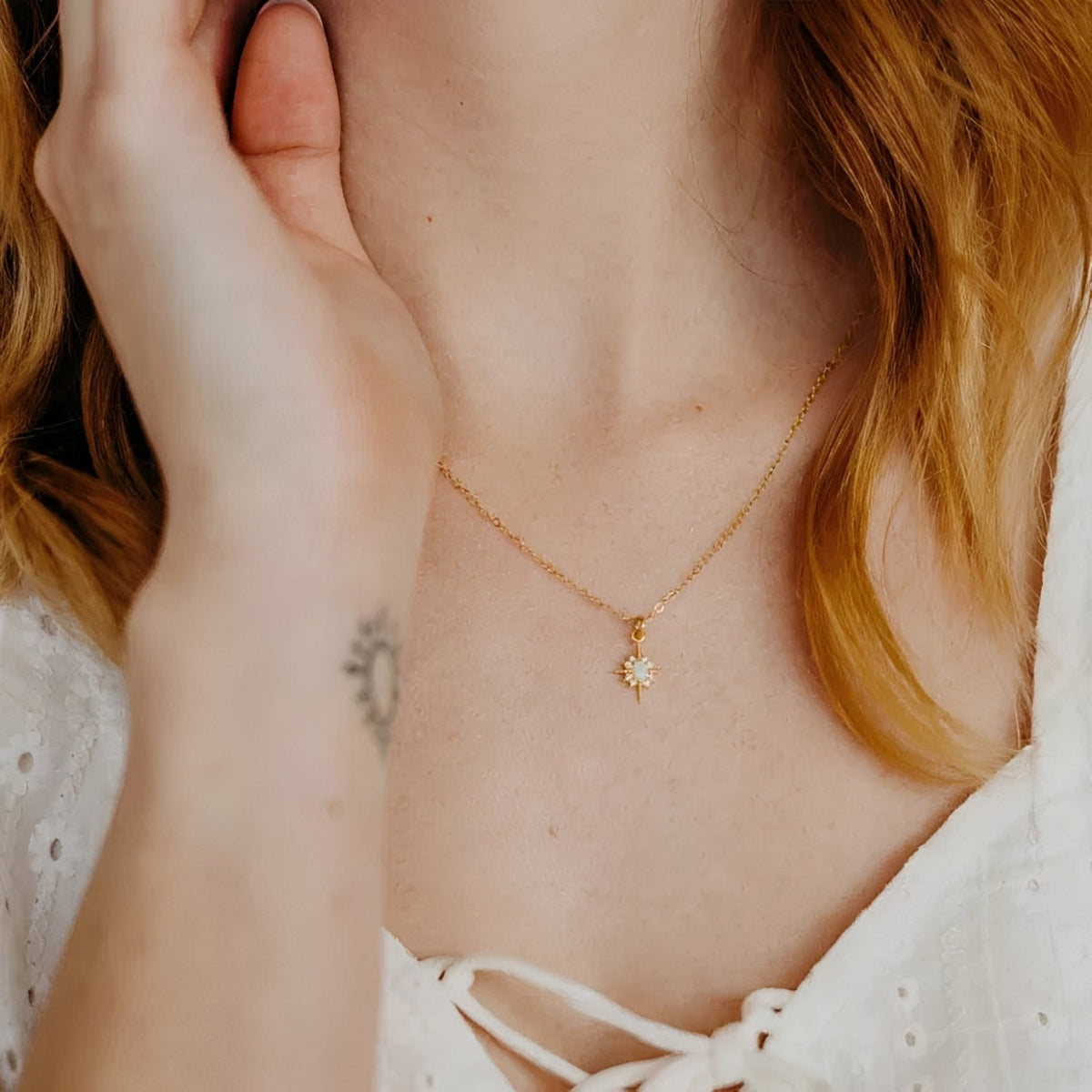 Women's Pendant Necklace with Oval Center Stone and Star Ray Design