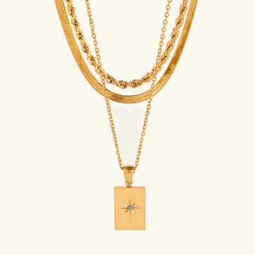 Women's Multilayered Necklace with Three Fine Chains and Stone Accents