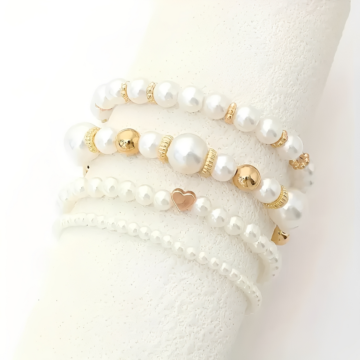 Women's 4-piece stackable bracelet set with pearl details and heart charm