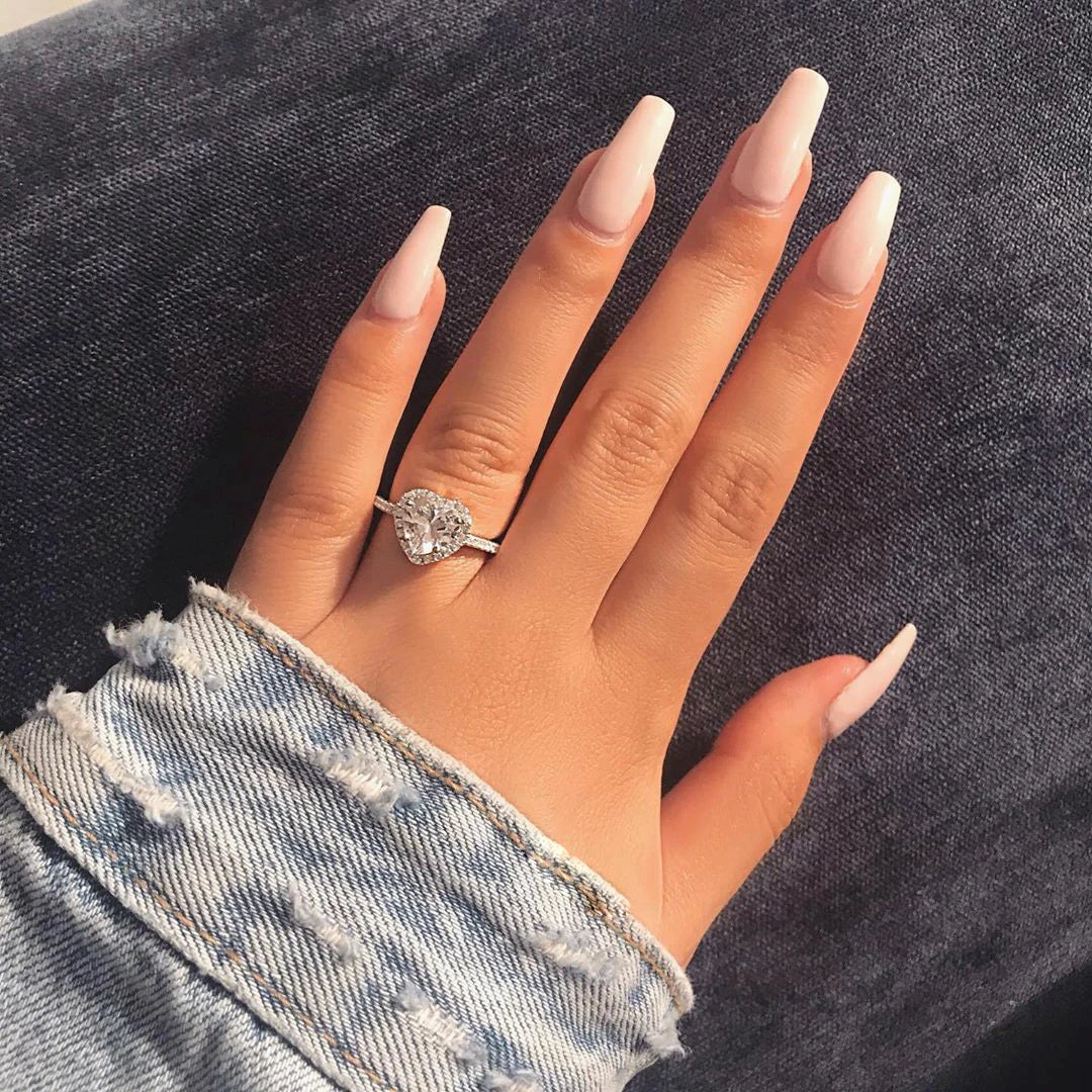 Women's Heart Ring with a Single Stone and Faceted Heart Design