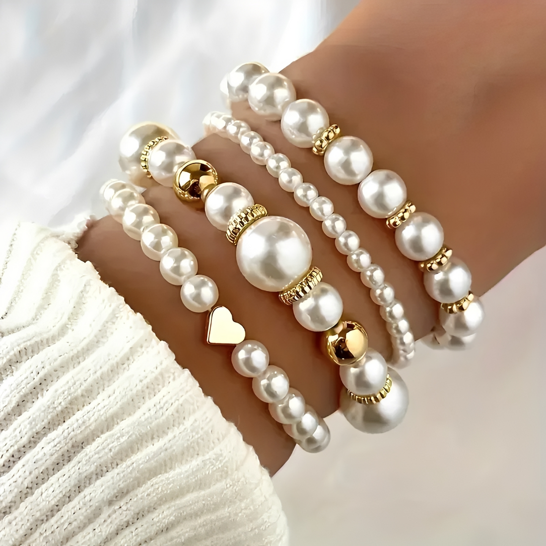 Women's 4-piece stackable bracelet set with pearl details and heart charm