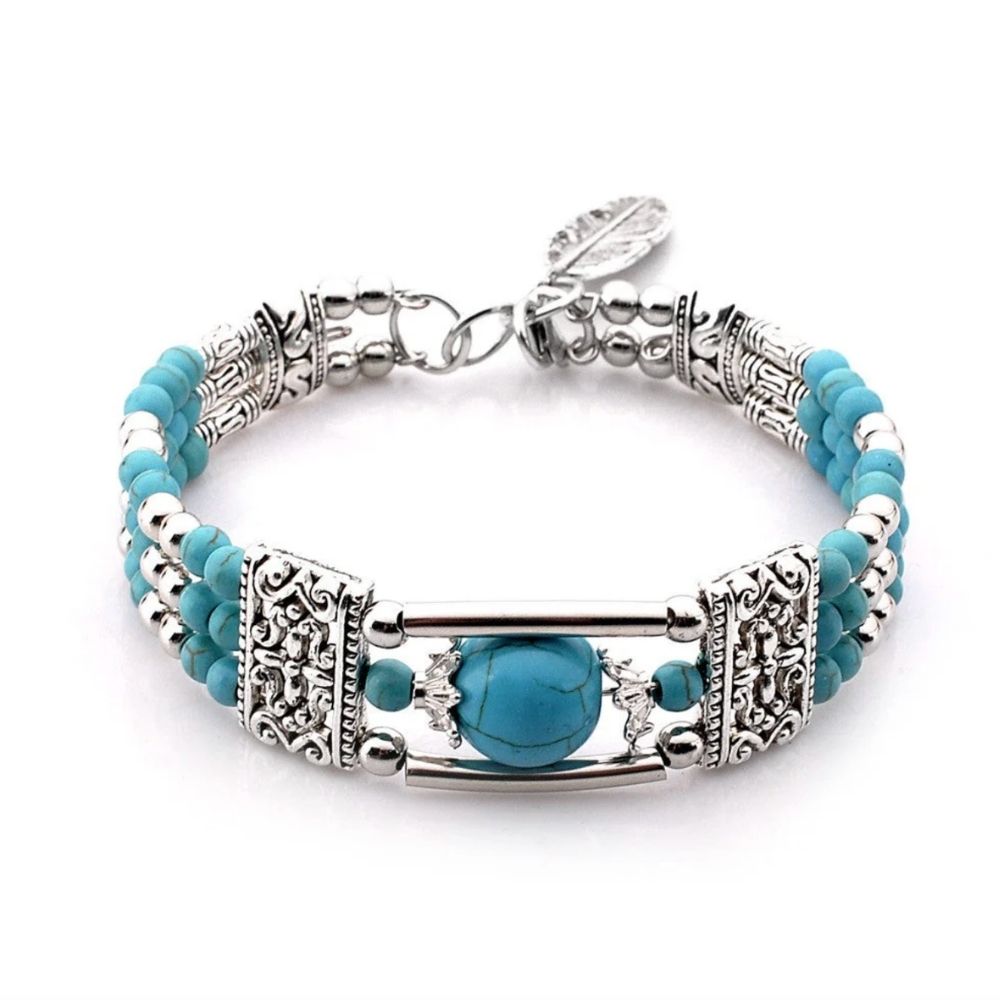 Women’s Multi-Strand Pearl Bracelet with Round Center Piece and Ornamental Details